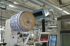 Installation utilizing the customers existing silenced pickup chute with the large roll of waste being wound up.  This is where the waste being extracted will enter the pneumatic conveying system and do away with the need to roll the waste.